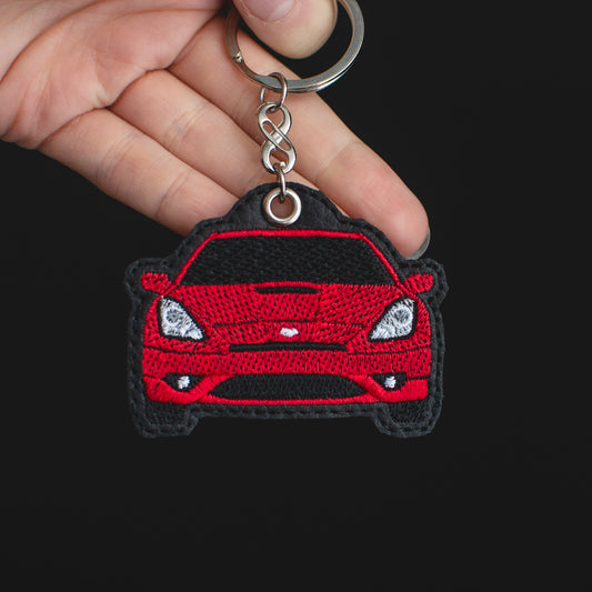 Zdjęcie produktu haftowanego breloka EnczArts czerwona Toyota Celica VII