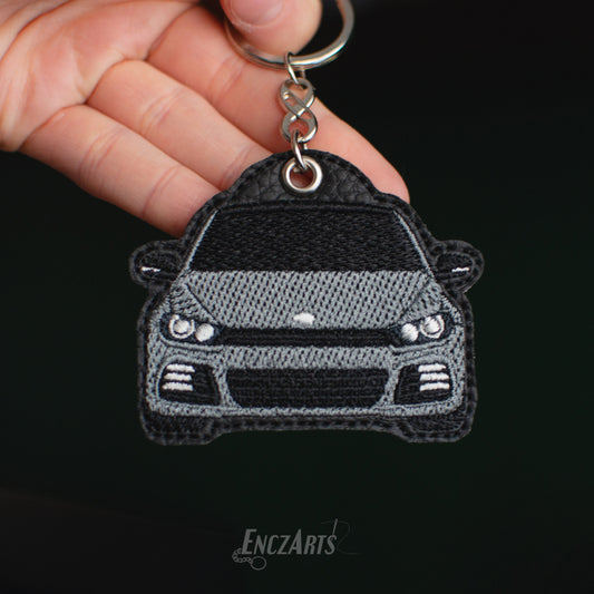 Personalizowany brelok EnczArts z haftem Volkswagen Scirocco III. Idealny prezent dla kierowcy i pasjonata samochodów. 